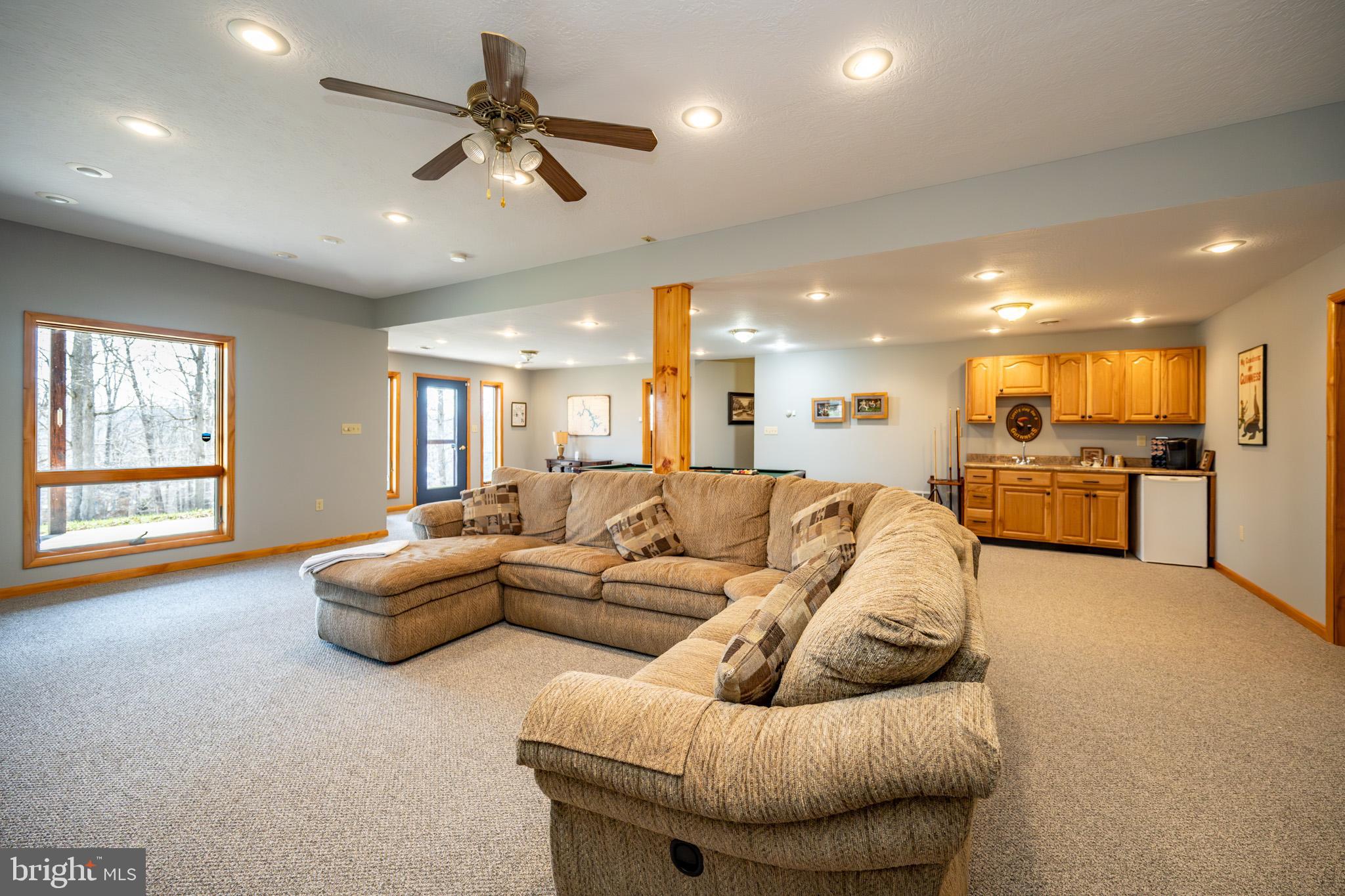 167 Sears Lane Swanton, MD 21561 - Photo 39 of 48 a living room with furniture and kitchen view