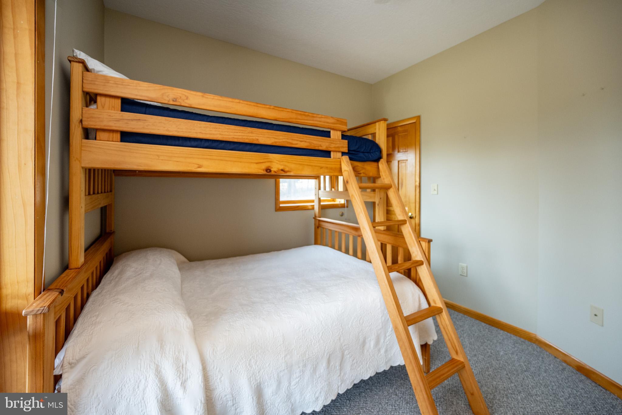 167 Sears Lane Swanton, MD 21561 - Photo 44 of 48 a bedroom with a bed and a window