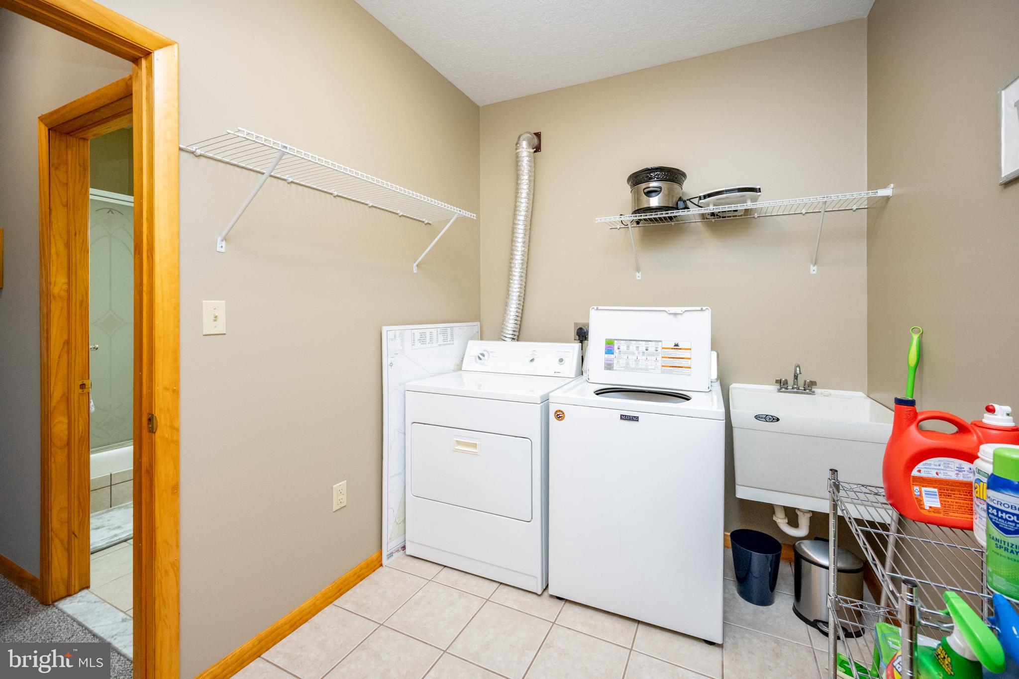 167 Sears Lane Swanton, MD 21561 - Photo 47 of 48 a utility room with dryer and washer
