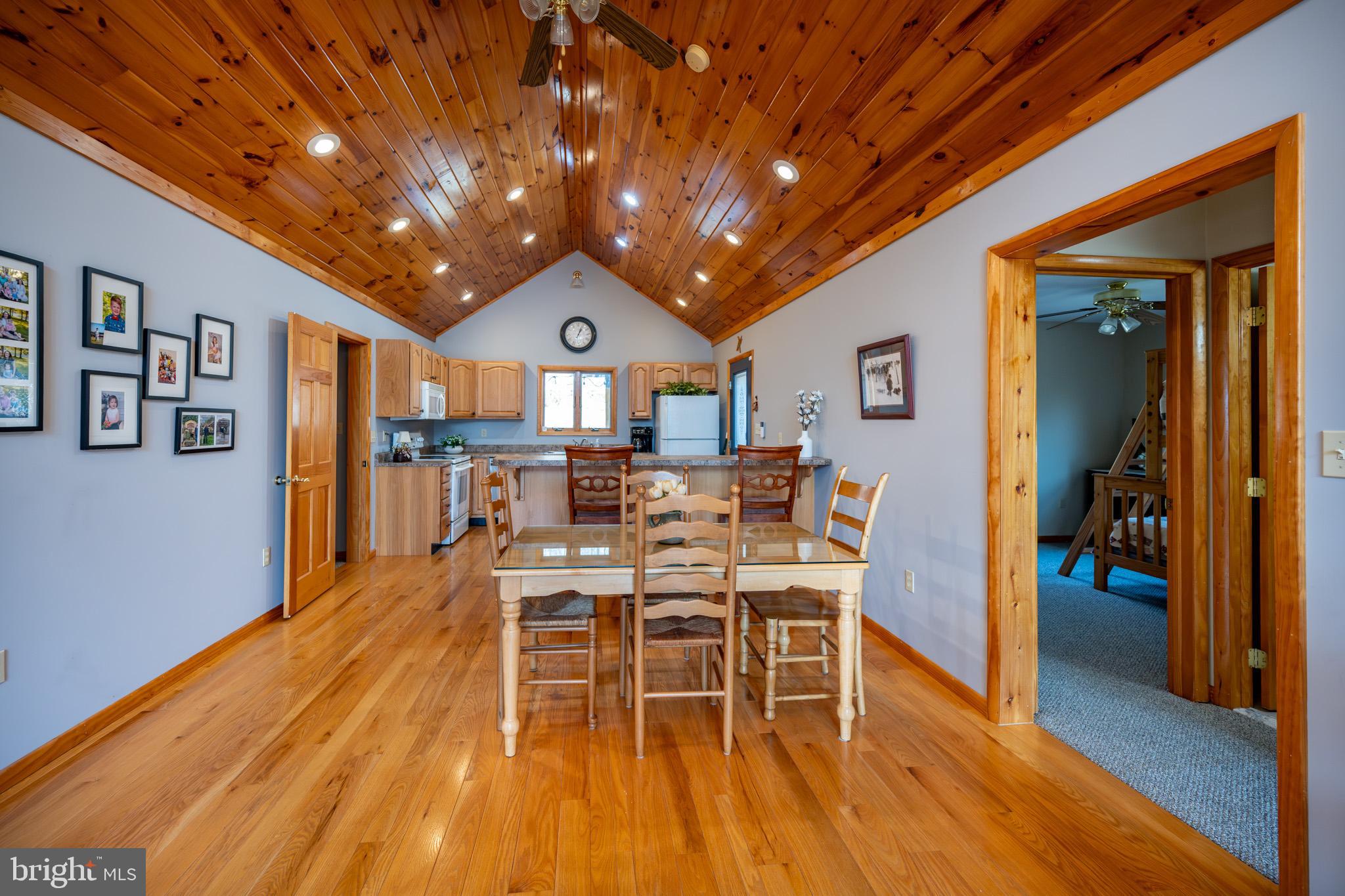 167 Sears Lane Swanton, MD 21561 - Photo 10 of 48 a view of a dining room with furniture window and wooden floor