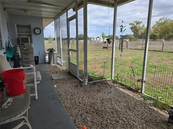 a view of a porch with chairs