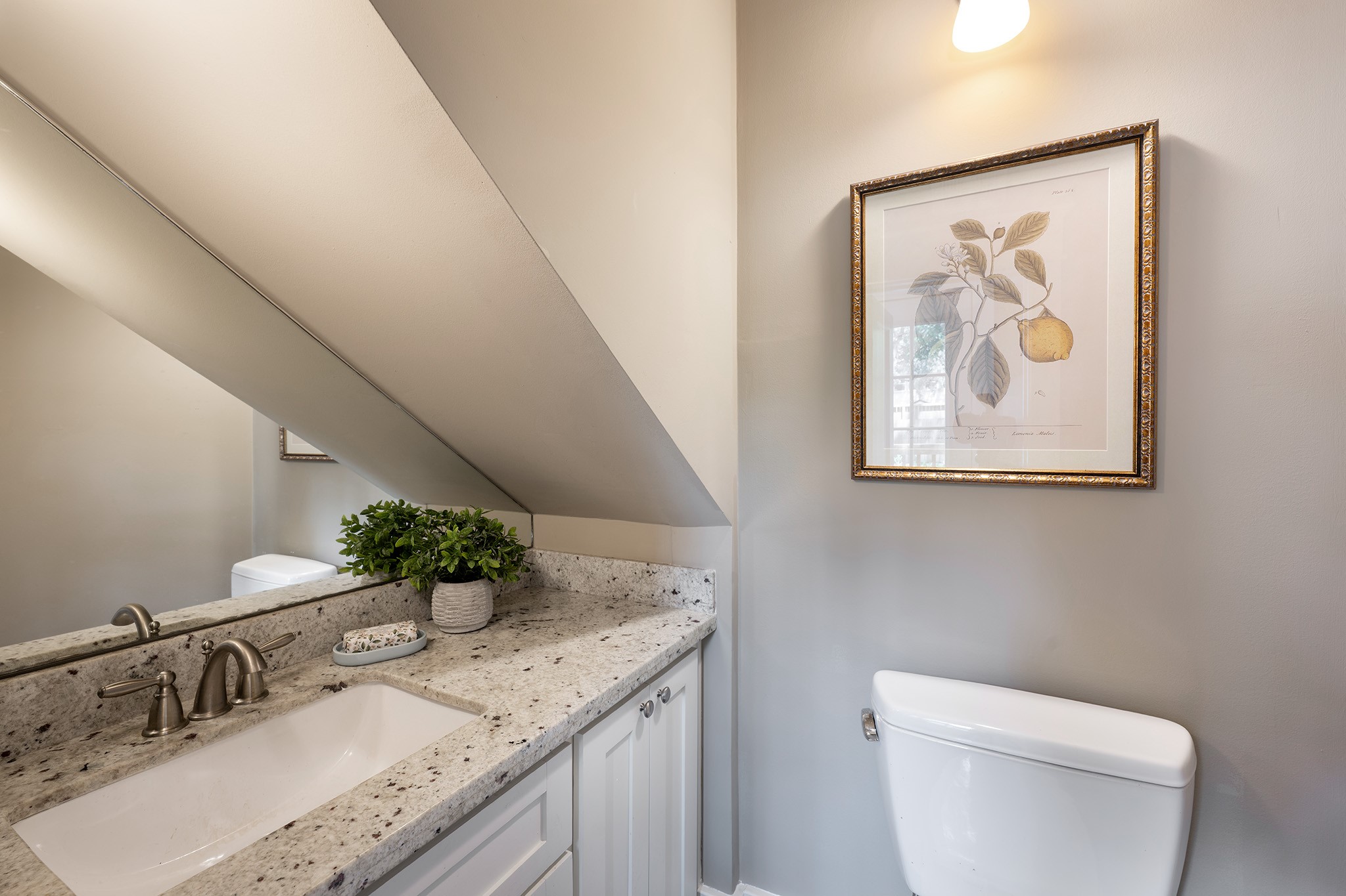 1640 Sul Ross Street Houston, TX 77006 - Photo 11 of 35 a bathroom with a granite countertop sink a large mirror and toilet