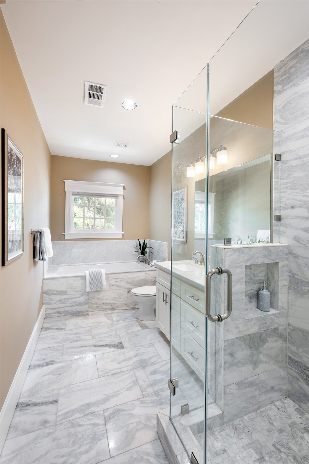 1640 Sul Ross Street Houston, TX 77006 - Photo 13 of 35 a large bedroom with a large window and furniture