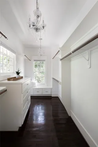 a kitchen with a refrigerator a sink and dishwasher with wooden floor