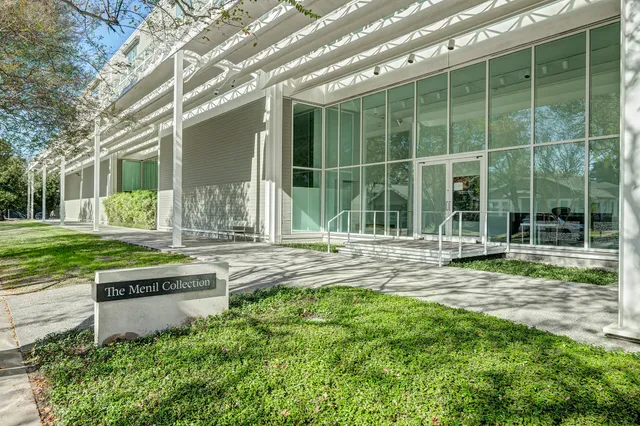 a bathroom with a toilet a sink and a window