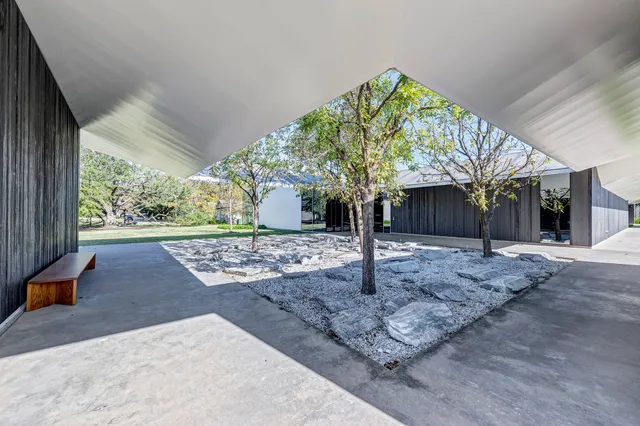 a backyard of a house with lots of green space