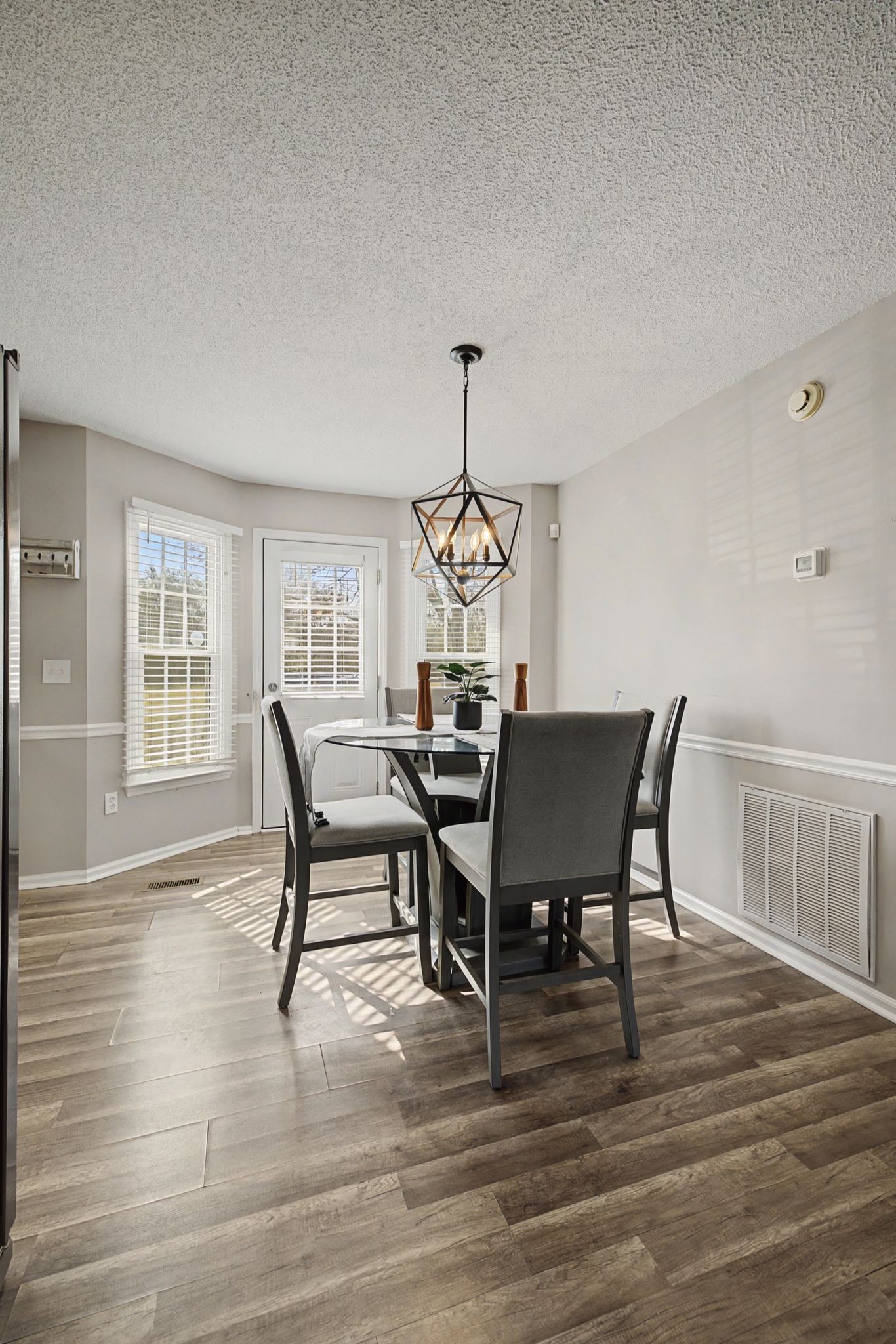 723 Hogan Drive Murfreesboro, TN 37128 - Photo 11 of 31 a dining room with furniture a chandelier and wooden floor