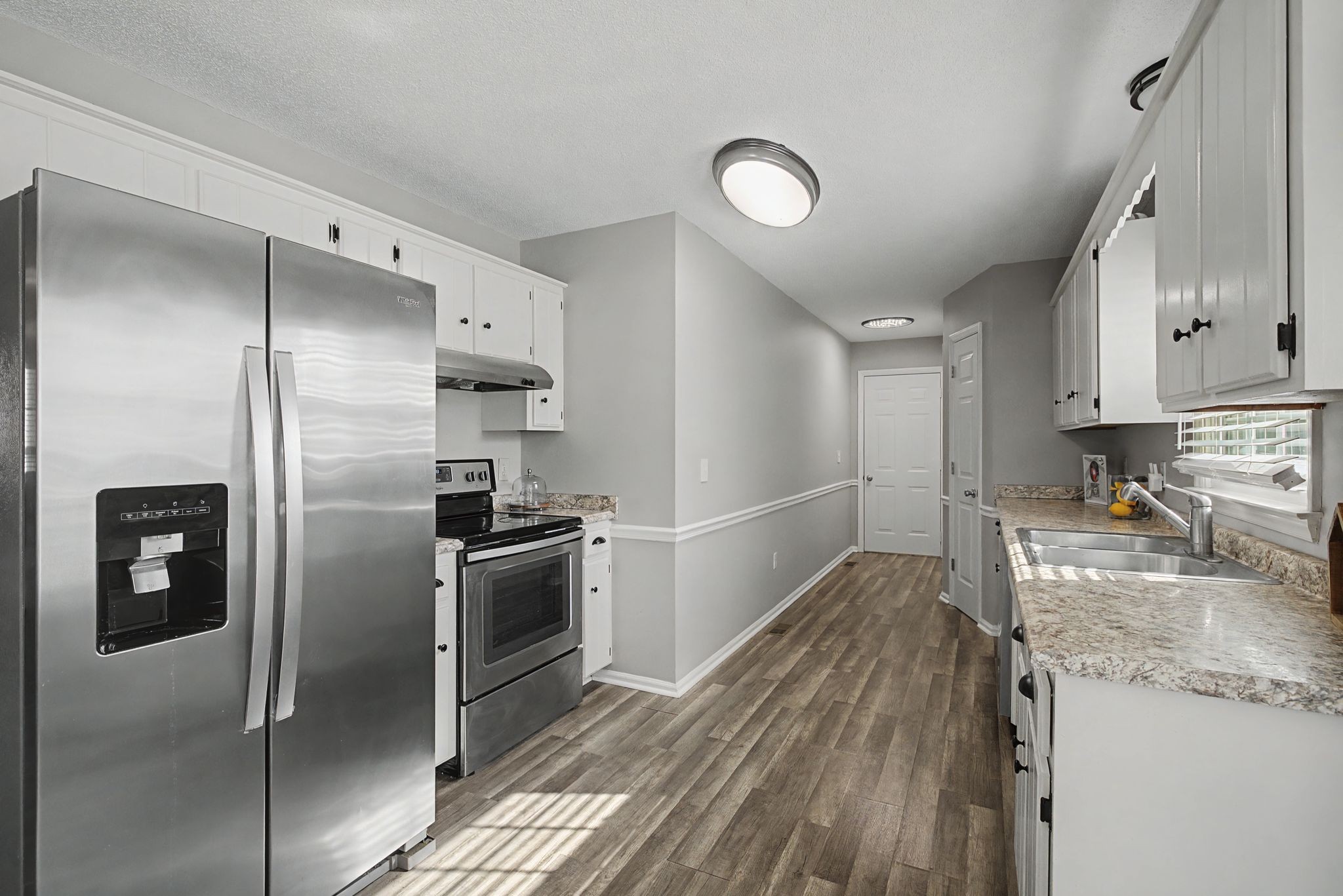 723 Hogan Drive Murfreesboro, TN 37128 - Photo 13 of 31 a kitchen with a refrigerator and a sink