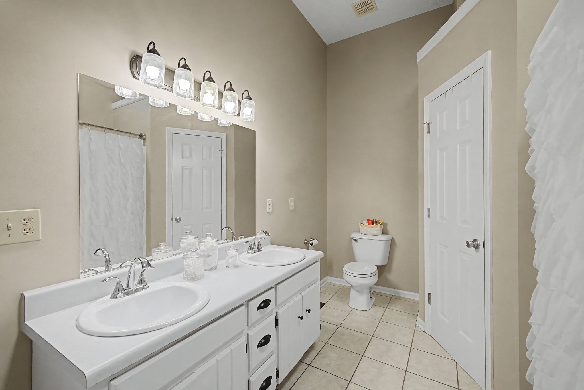 723 Hogan Drive Murfreesboro, TN 37128 - Photo 21 of 31 a bathroom with a double vanity sink mirror and toilet