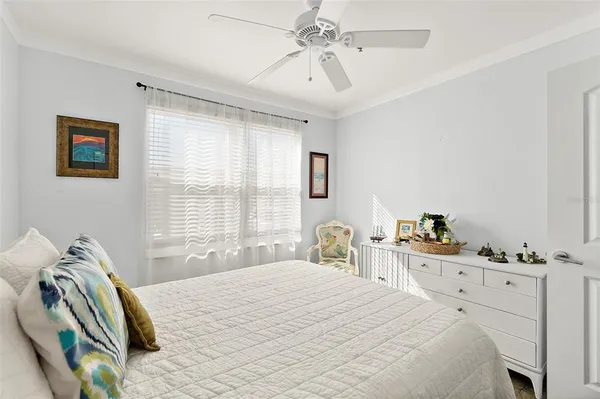 a kitchen with stainless steel appliances a table chairs refrigerator and microwave