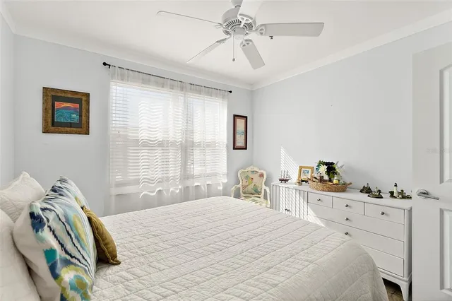 a kitchen with stainless steel appliances a table chairs refrigerator and microwave