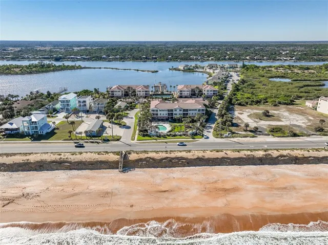 a view of a balcony with wooden floor and outdoor seating
