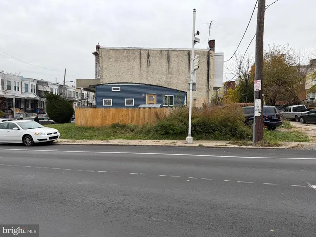a view of a street with cars