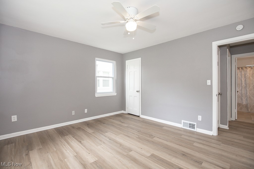 1547 Genesee Road South Euclid, OH 44121 - Photo 14 of 36 Spare room with a ceiling fan, light wood finished floors, and baseboards