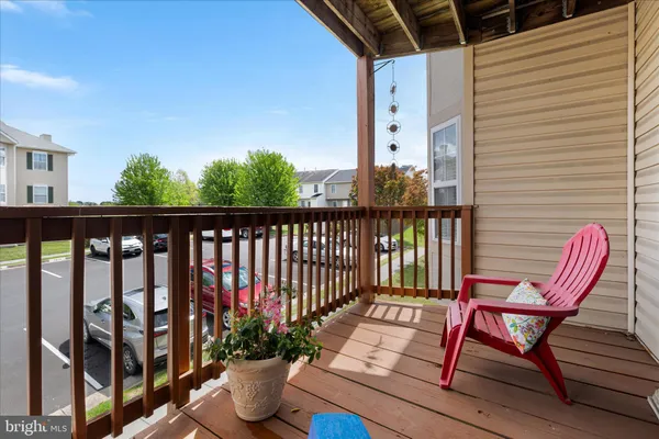 a view of a chairs in wooden deck