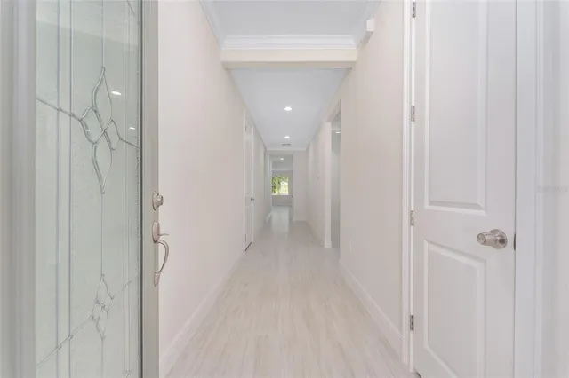 a view of a hallway with wooden shelves