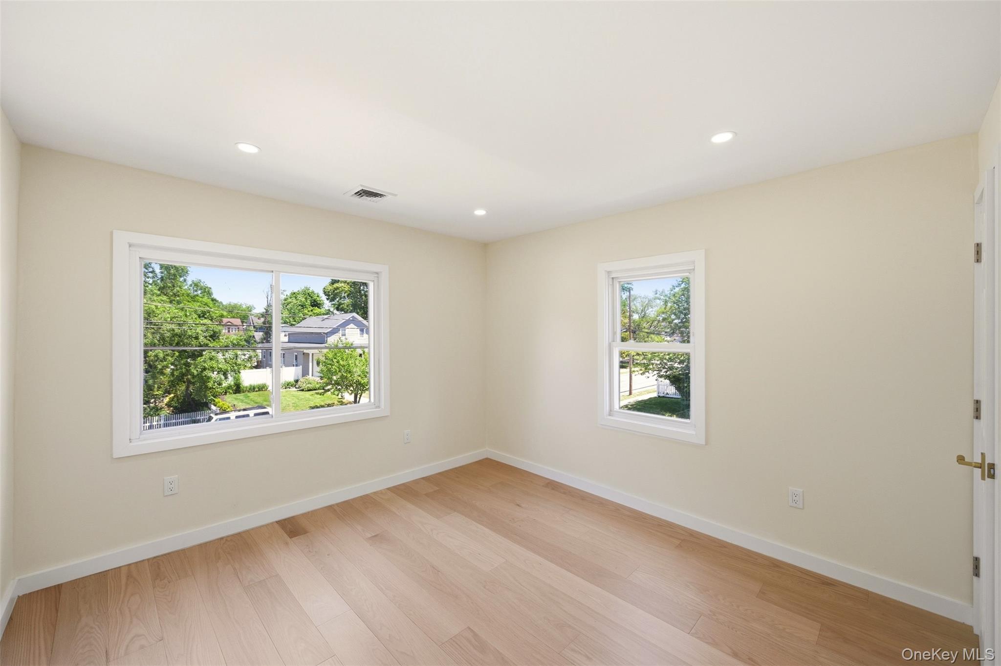 135 Whaley Street Freeport, NY 11520 - Photo 30 of 38 an empty room with windows