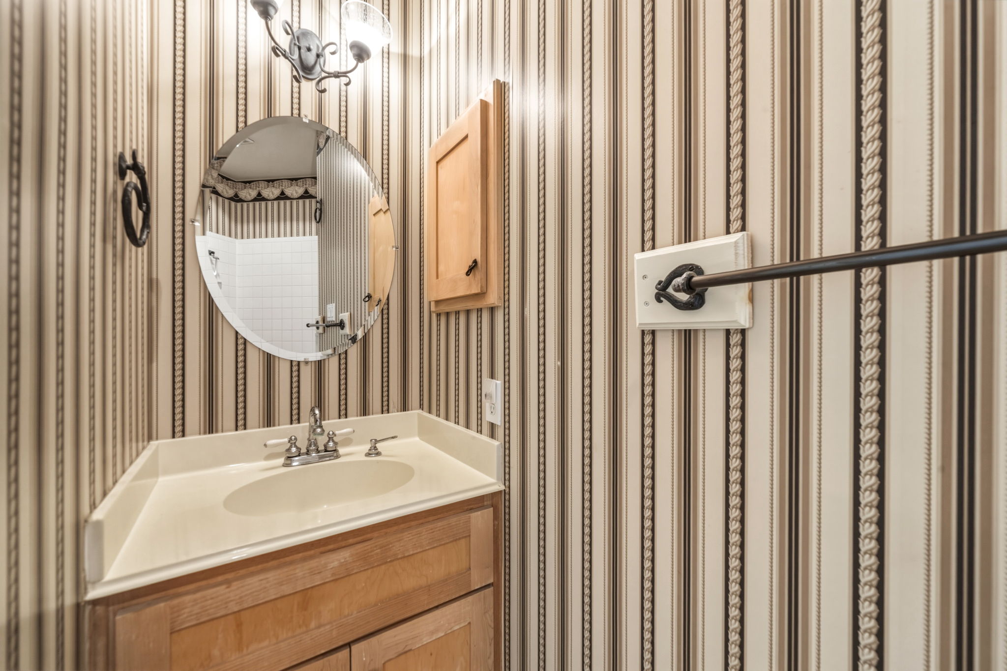 14039 Timberline Trail Austin, TX 78737 - Photo 19 of 39 Half bath with vanity and wallpapered walls