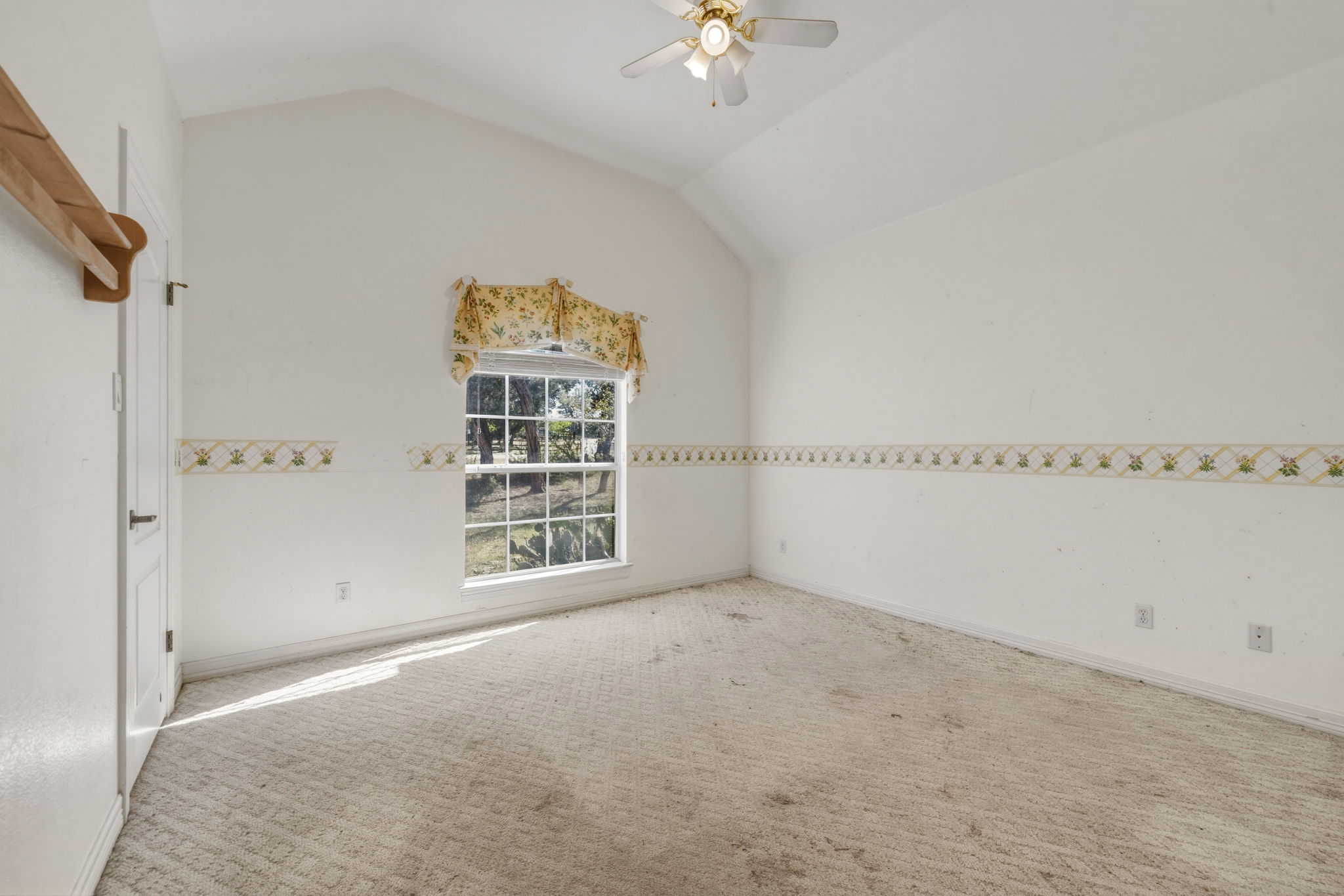 14039 Timberline Trail Austin, TX 78737 - Photo 21 of 39 Carpeted empty room with vaulted ceiling and ceiling fan