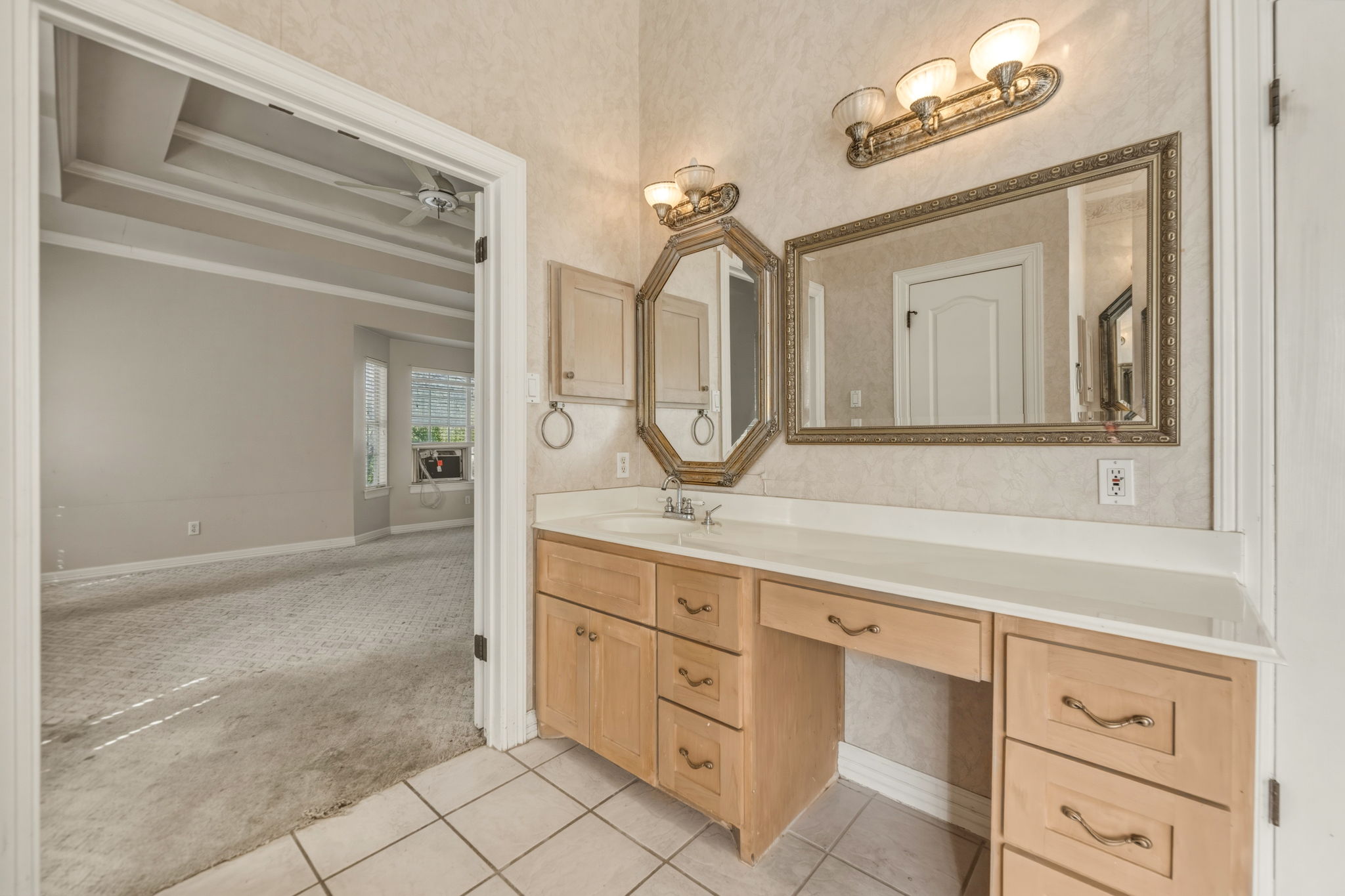 14039 Timberline Trail Austin, TX 78737 - Photo 25 of 39 Bathroom featuring vanity, light carpet, light tile patterned floors, wallpapered walls, and ornamental molding