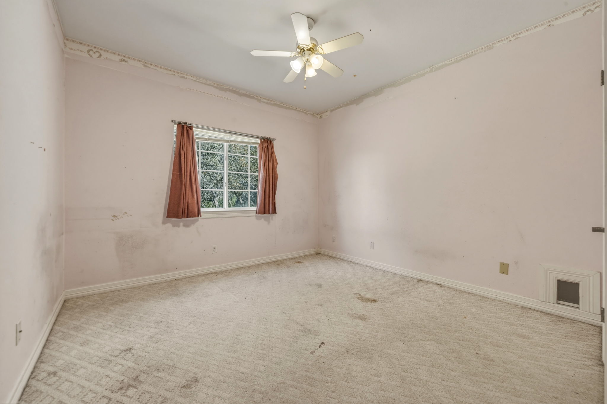 14039 Timberline Trail Austin, TX 78737 - Photo 29 of 39 Carpeted spare room with baseboards and ceiling fan