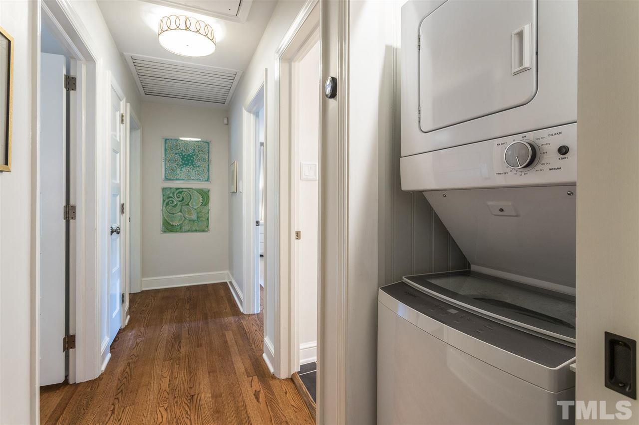 3425 Leonard Street Raleigh, NC 27607 - Photo 14 of 28 a view of a hallway with wooden floor