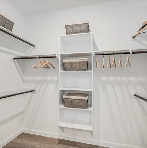 a view of an ocean with boats and trees in the background