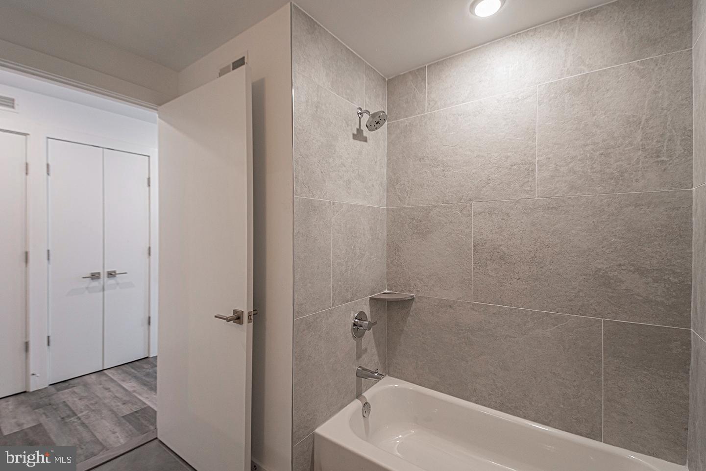 1245 Ridge Avenue, Unit 103 Philadelphia, PA 19123 - Photo 4 of 18 a bathroom with a bathtub