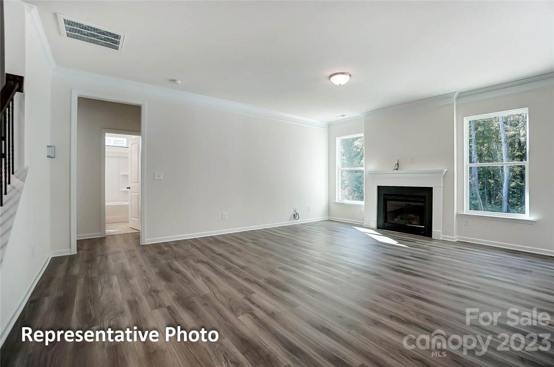 109 Old Fld Road Statesville, NC 28677 - Photo 16 of 37 a view of a livingroom with wooden floor and a fireplace
