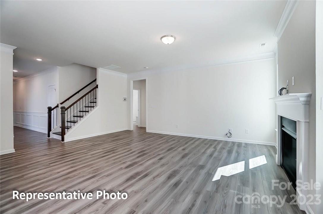 109 Old Fld Road Statesville, NC 28677 - Photo 18 of 37 a view of an empty room with wooden floor and stairs