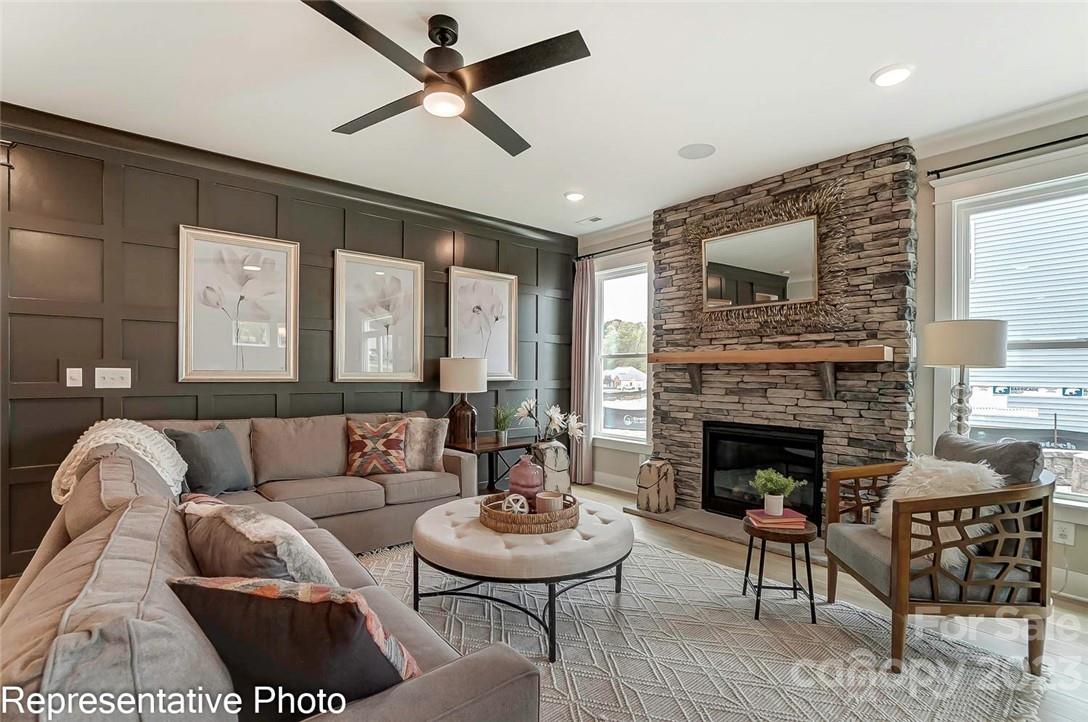 109 Old Fld Road Statesville, NC 28677 - Photo 10 of 37 a living room with furniture and a fireplace