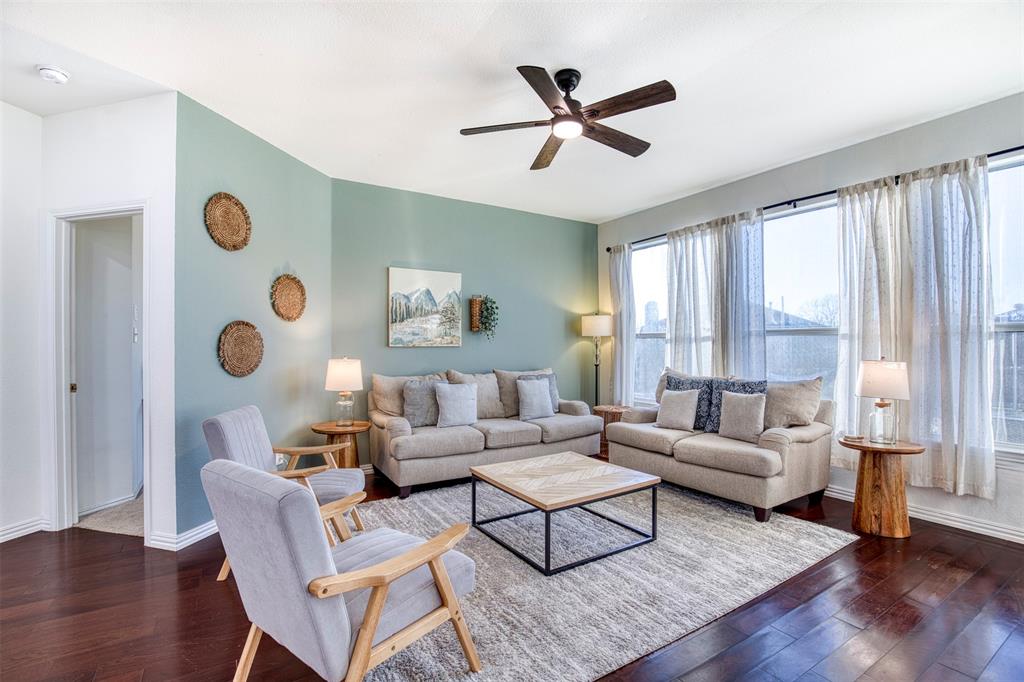 2805 Whetstone Drive Corinth, TX 76210 - Photo 7 of 38 a living room with furniture and wooden floor