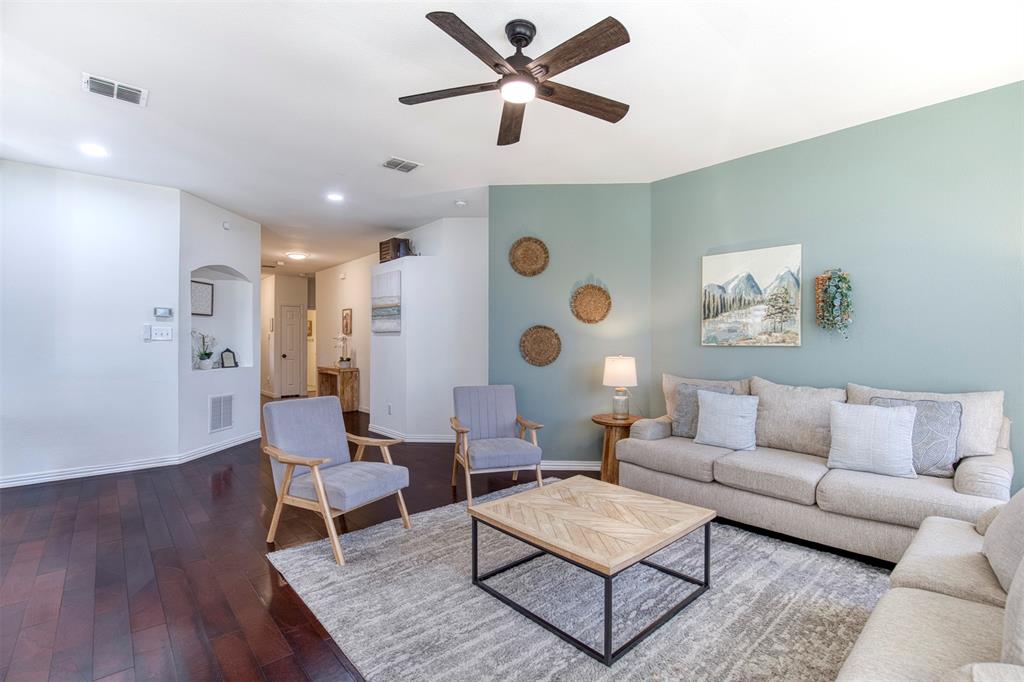 2805 Whetstone Drive Corinth, TX 76210 - Photo 8 of 38 a living room with furniture and wooden floor