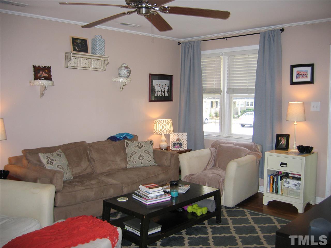 2331 Bernard Street, Unit 2331 Raleigh, NC 27608 - Photo 3 of 12 a living room with furniture fireplace and a window