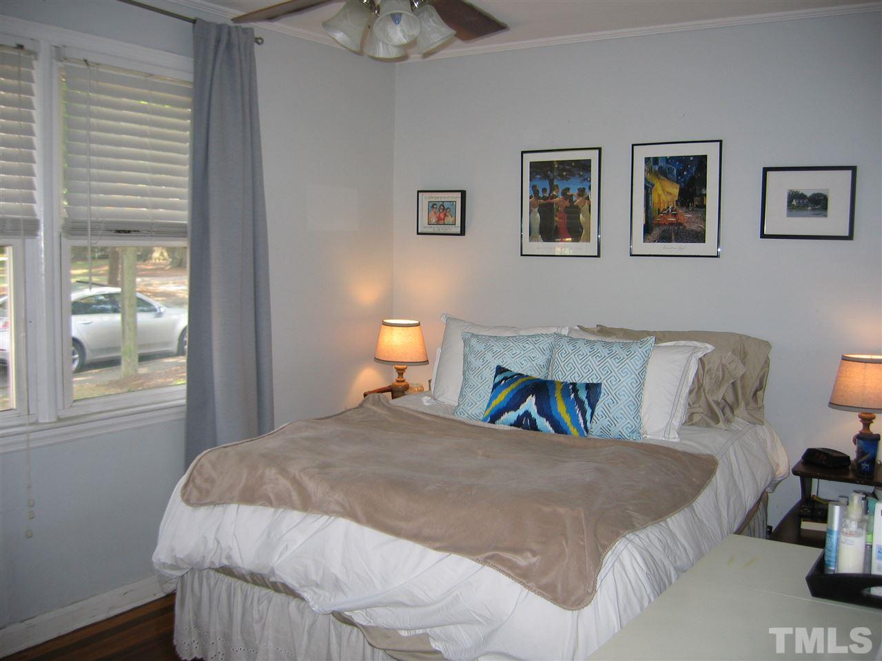 2331 Bernard Street, Unit 2331 Raleigh, NC 27608 - Photo 8 of 12 a bedroom with a bed and a window