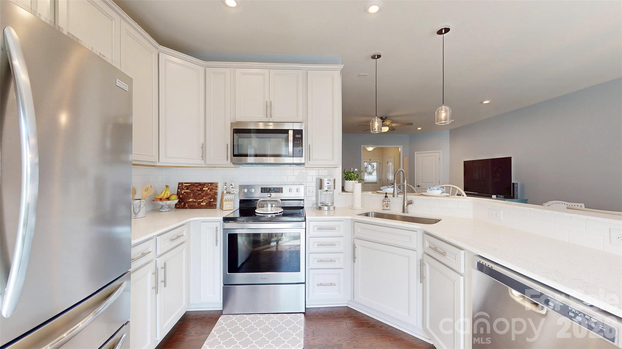 827 Canoe Song Road Fort Mill, SC 29708 - Photo 14 of 33 a kitchen with appliances a sink and cabinets