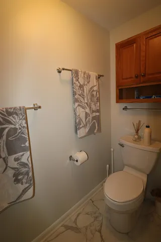 a bathroom with a toilet and a sink