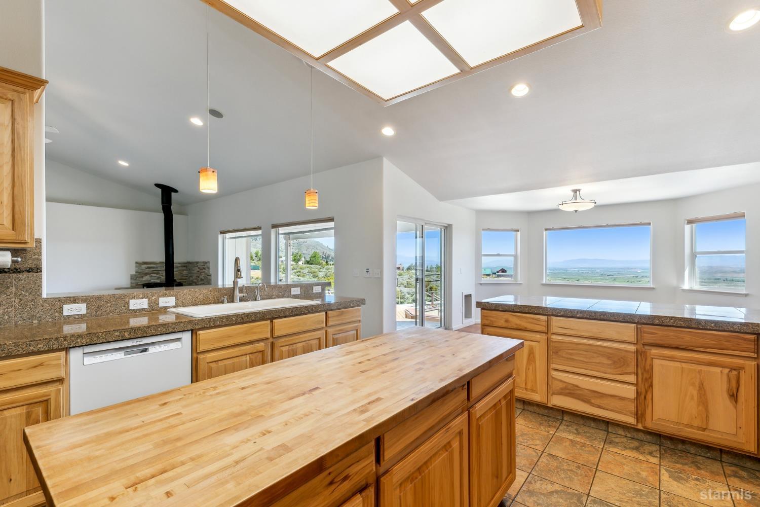 705 Sunrise Trail Markleeville, CA 96120 - Photo 11 of 39 a large kitchen with kitchen island a sink stainless steel appliances and cabinets