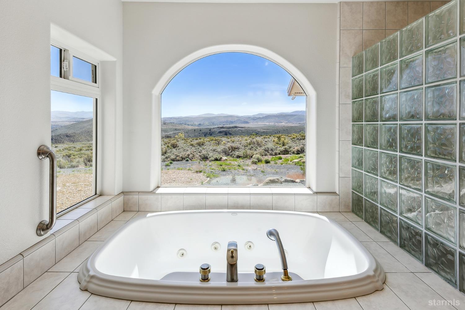 705 Sunrise Trail Markleeville, CA 96120 - Photo 15 of 39 a bath tub sitting in a bathroom next to a window