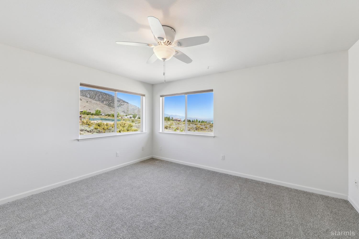 705 Sunrise Trail Markleeville, CA 96120 - Photo 17 of 39 an empty room with windows and fan