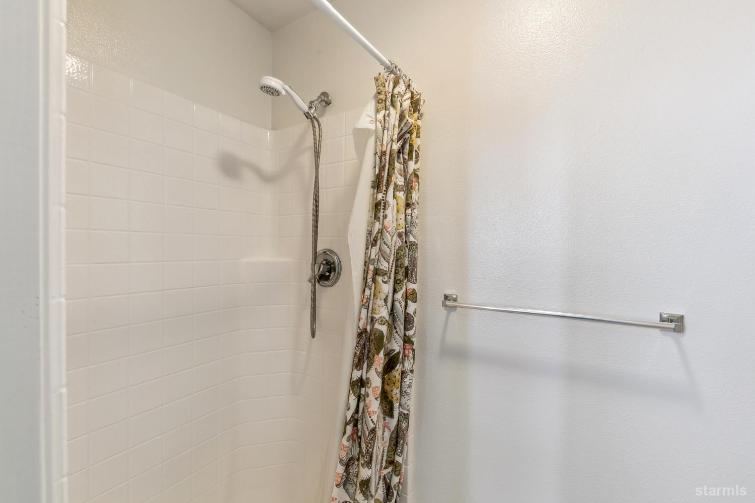 705 Sunrise Trail Markleeville, CA 96120 - Photo 21 of 39 a bathroom with a shower curtain