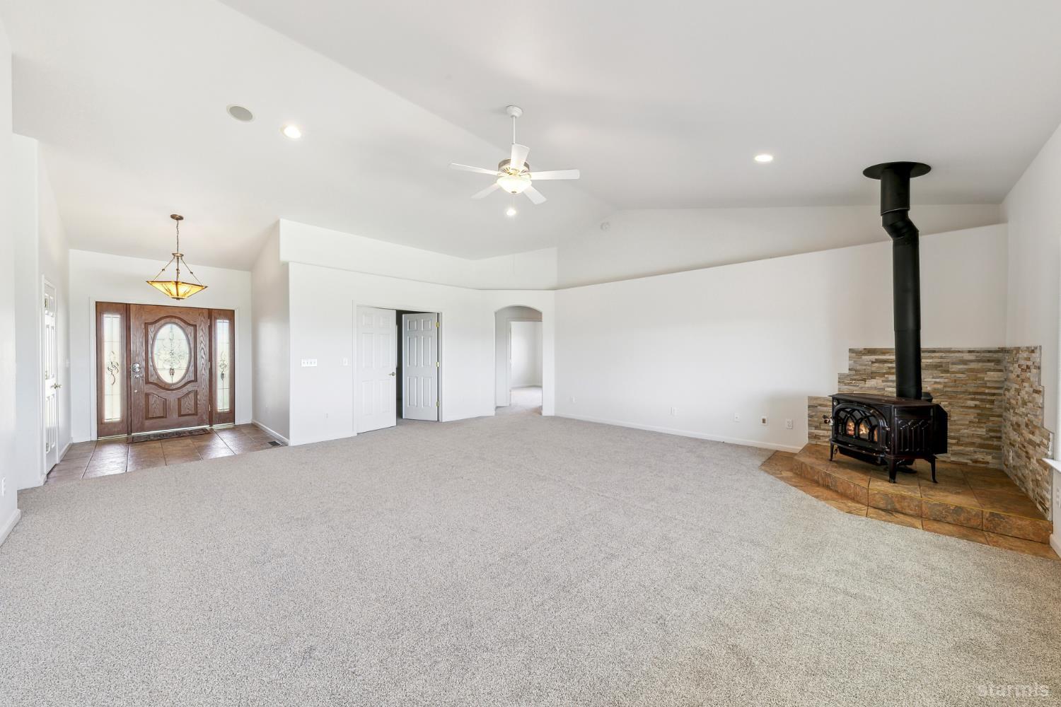 705 Sunrise Trail Markleeville, CA 96120 - Photo 4 of 39 a view of a room with gym equipment and a chandelier