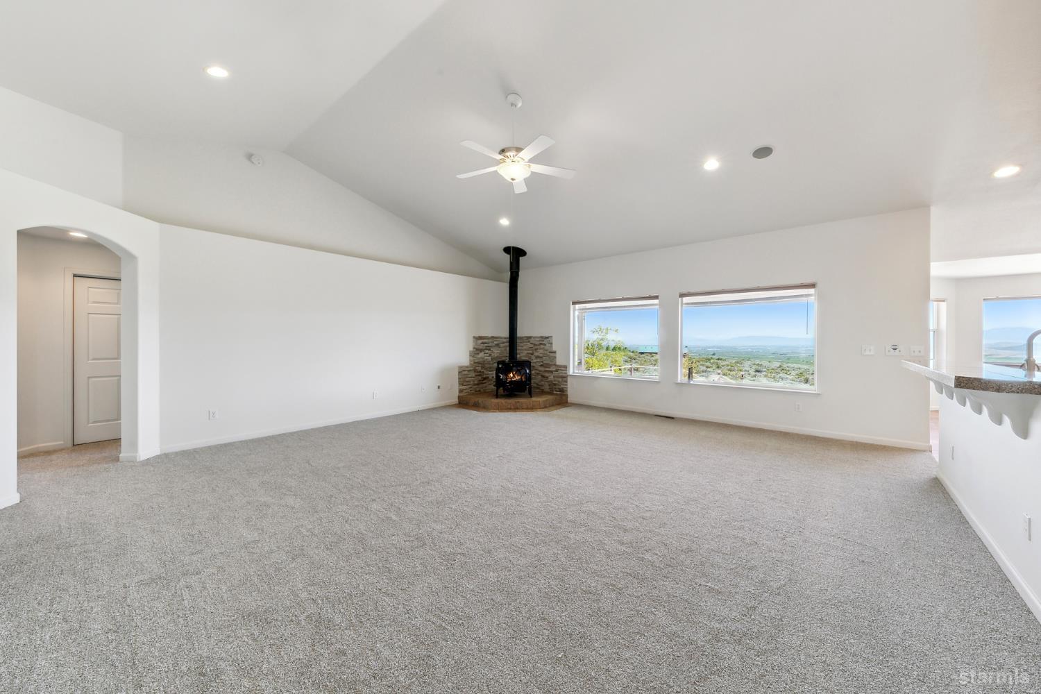 705 Sunrise Trail Markleeville, CA 96120 - Photo 5 of 39 an empty room with windows and fan