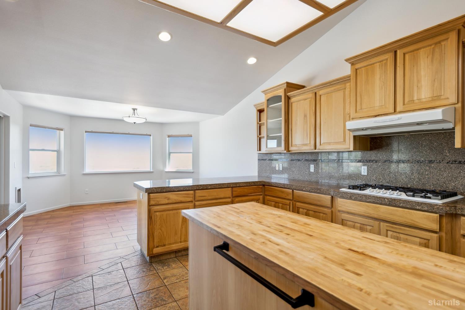 705 Sunrise Trail Markleeville, CA 96120 - Photo 9 of 39 a kitchen with a sink a stove cabinets and counter space