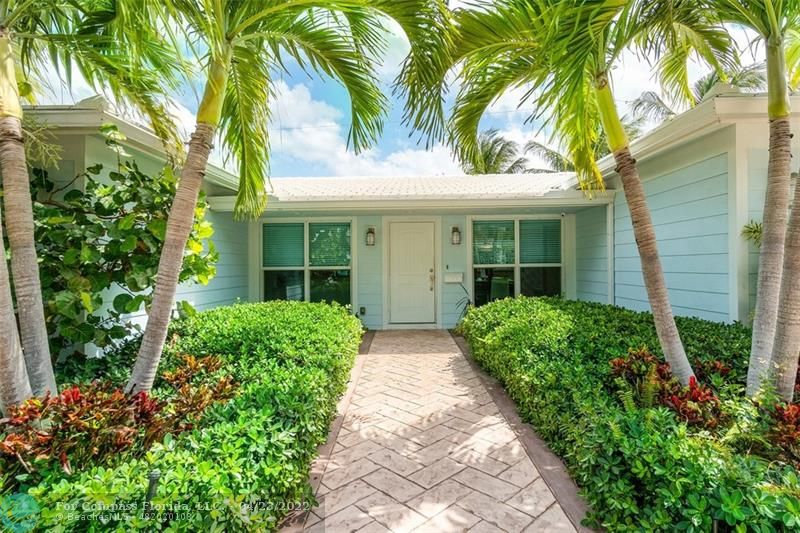 2932 Northeast 36th Street Lighthouse Point, FL 33064 - Photo 1 of 31 a view of a house with a flower garden