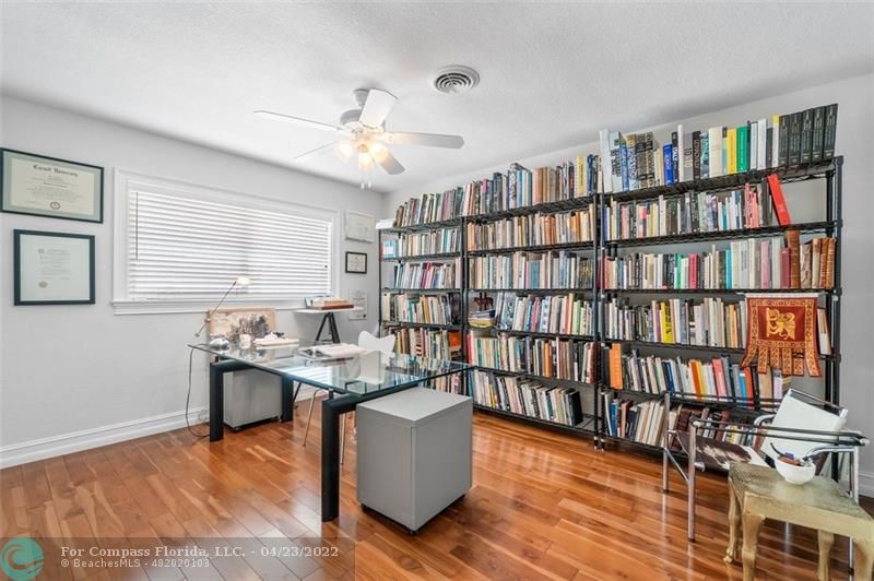 2932 Northeast 36th Street Lighthouse Point, FL 33064 - Photo 16 of 31 a living room with furniture and a book shelf
