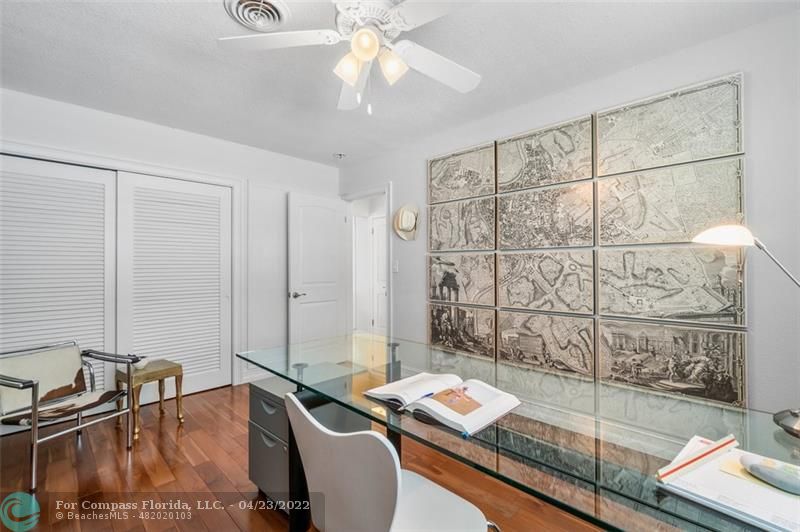 2932 Northeast 36th Street Lighthouse Point, FL 33064 - Photo 17 of 31 a room with a bed a rug and white walls