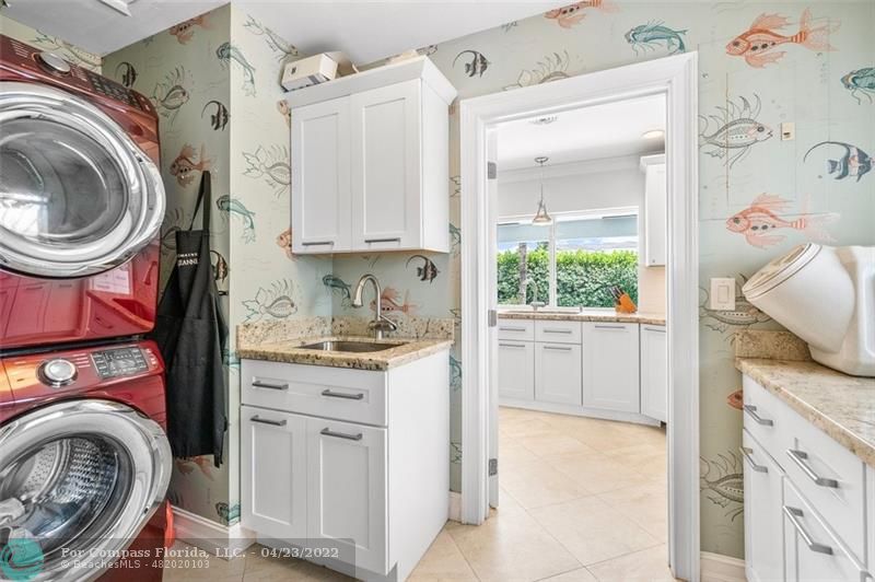 2932 Northeast 36th Street Lighthouse Point, FL 33064 - Photo 20 of 31 a view of a kitchen with washer and dryer