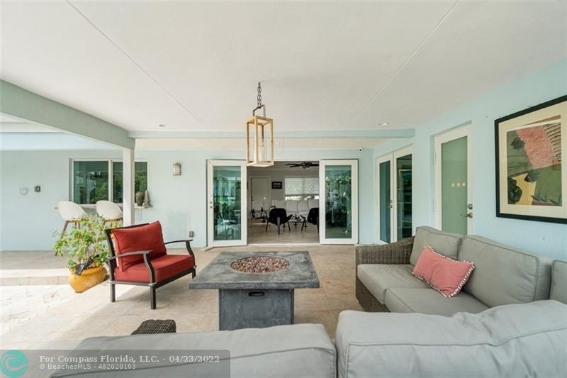 2932 Northeast 36th Street Lighthouse Point, FL 33064 - Photo 21 of 31 a living room with furniture and a large window