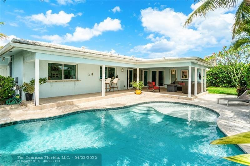 2932 Northeast 36th Street Lighthouse Point, FL 33064 - Photo 23 of 31 a view of a house with swimming pool and porch
